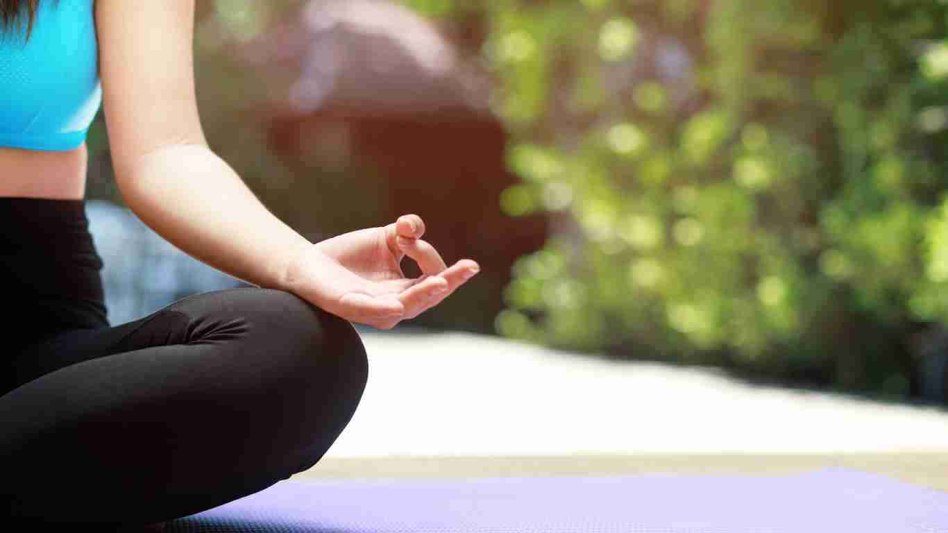 A woman meditating in nature