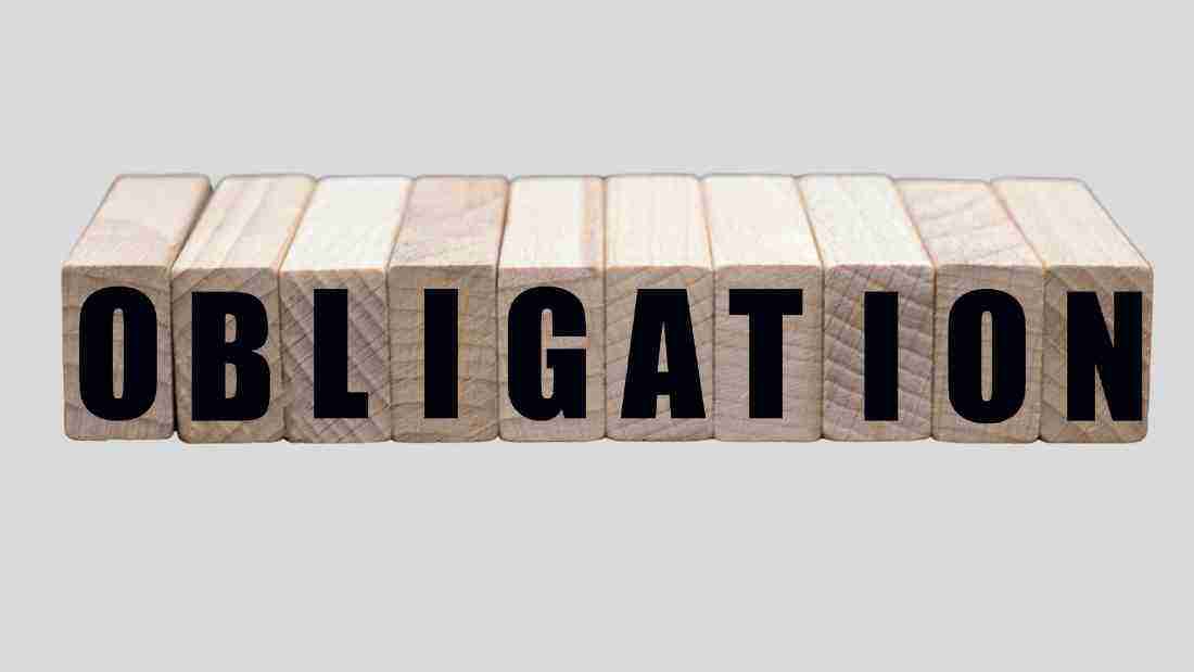 Wooden blocks forming the word OBLIGATION