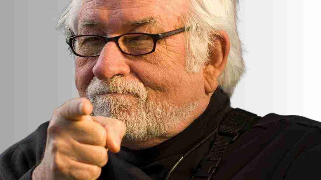 Old man pointing the finger at his victim