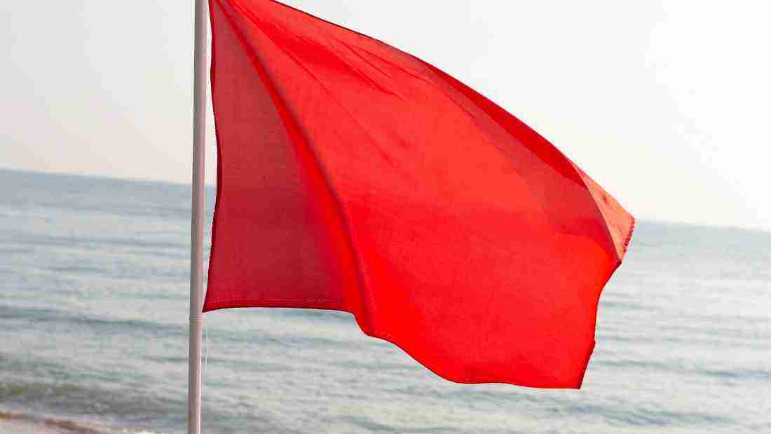 A red flag fluttering in the breeze
