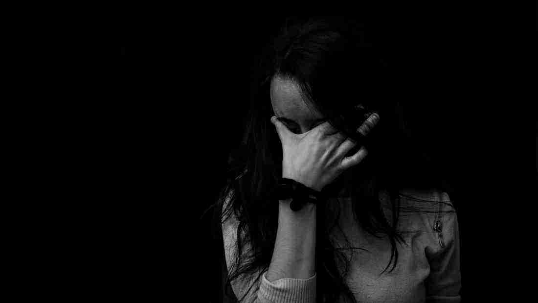 A woman who appears to be totally distraught and overwhelmed