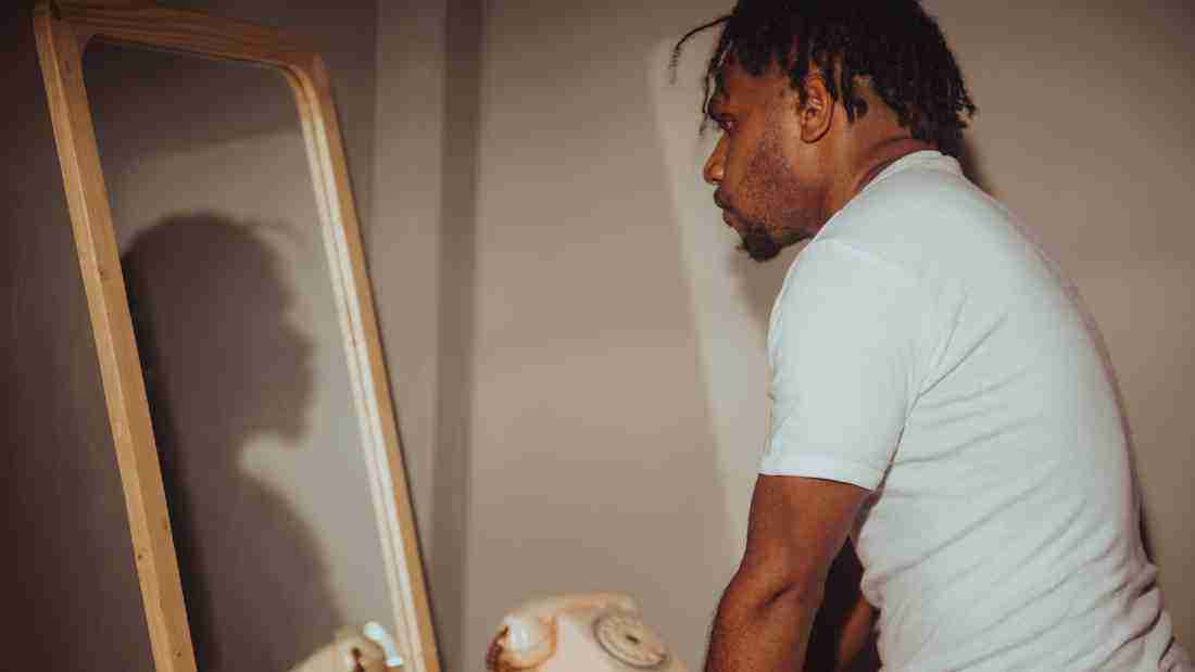 A man gazing in the mirror