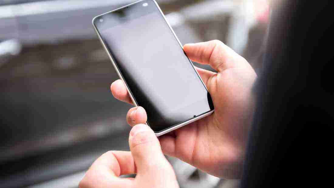 A man staring at his phone
