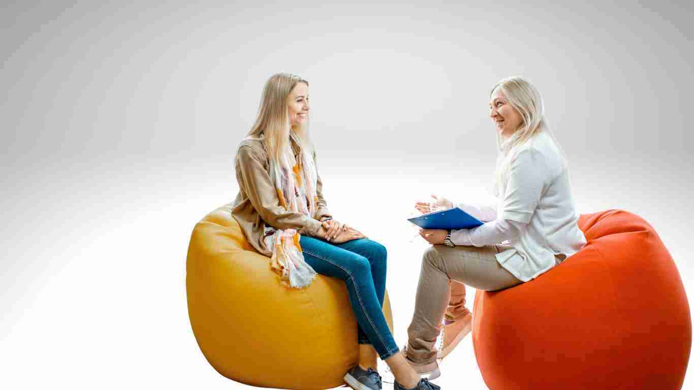 A young woman talking to her therapist