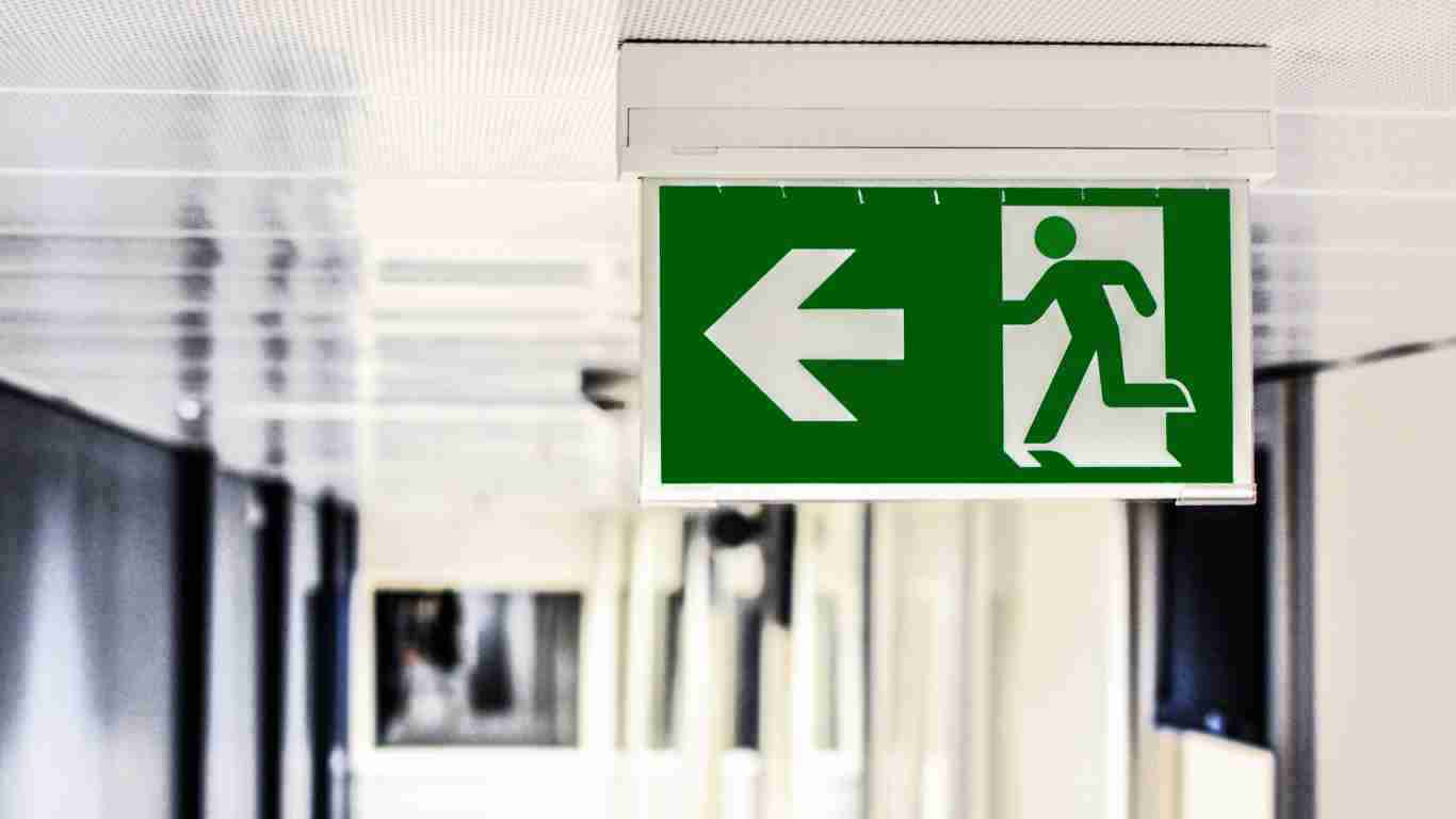 An exit sign with an arrow