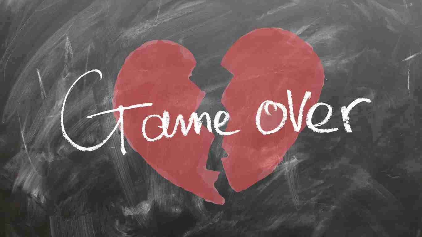 A broken heart with game over written on it