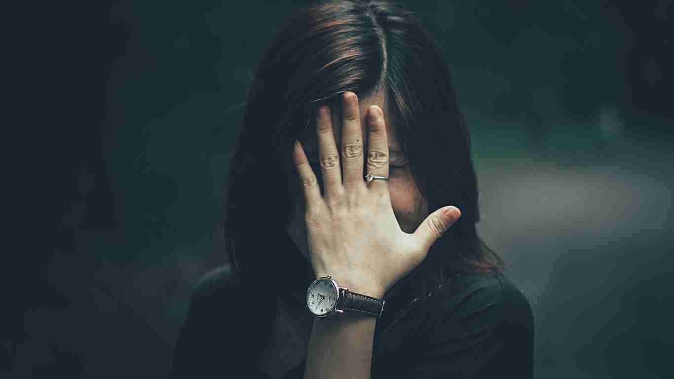 A woman looking very embarrassed