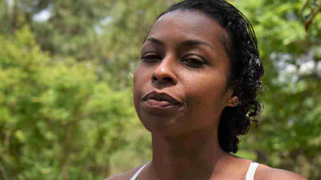 A woman who looks like she is blaming herself for something