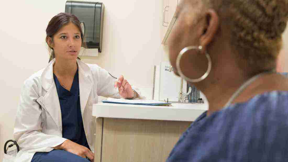 A doctor talking to her patient