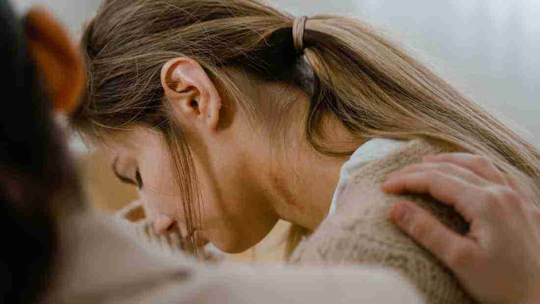 A woman who appears to be totally distraught