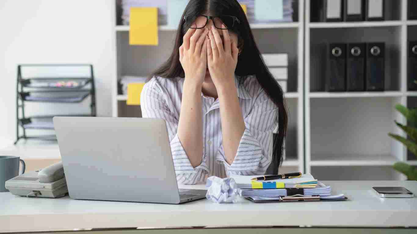 A depressed woman in an office