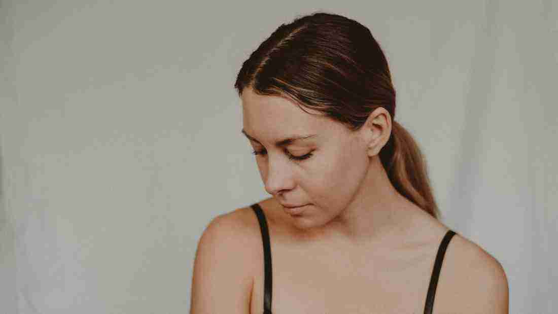A young woman who appears upset