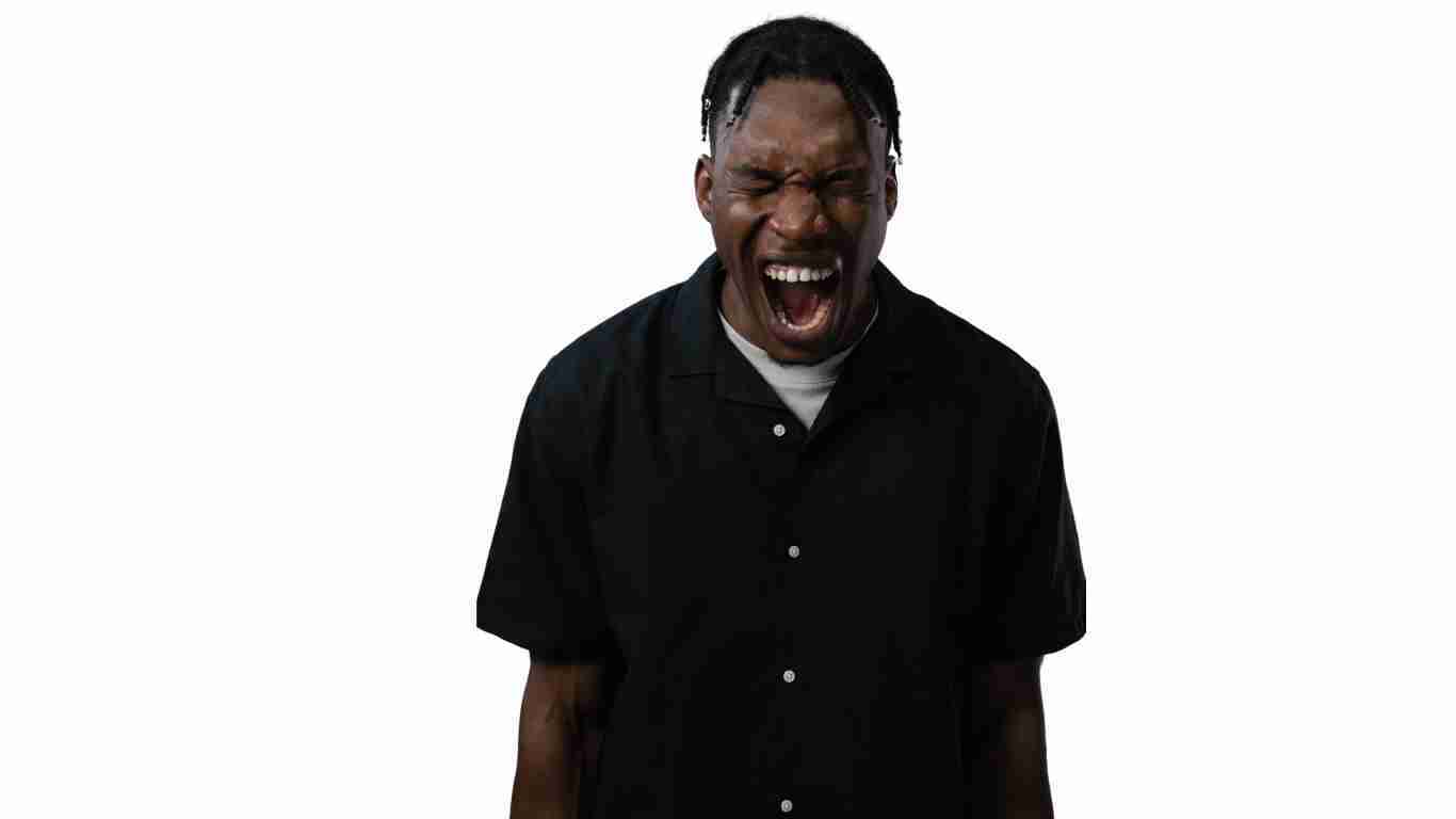 A furious man screaming with rage