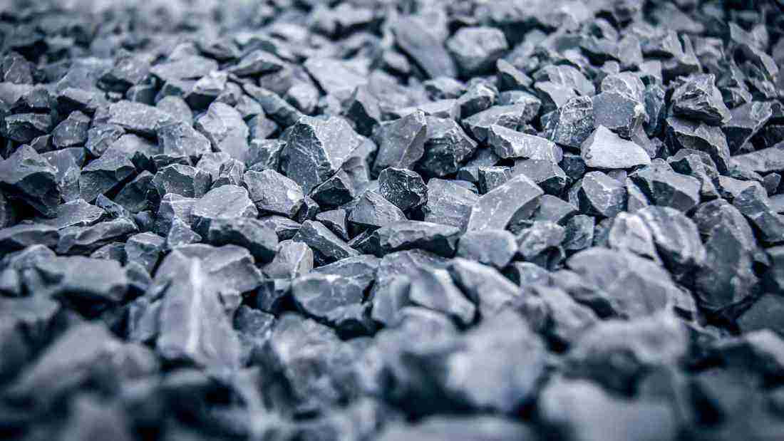 Lots of little grey pebbles on a rocky beach