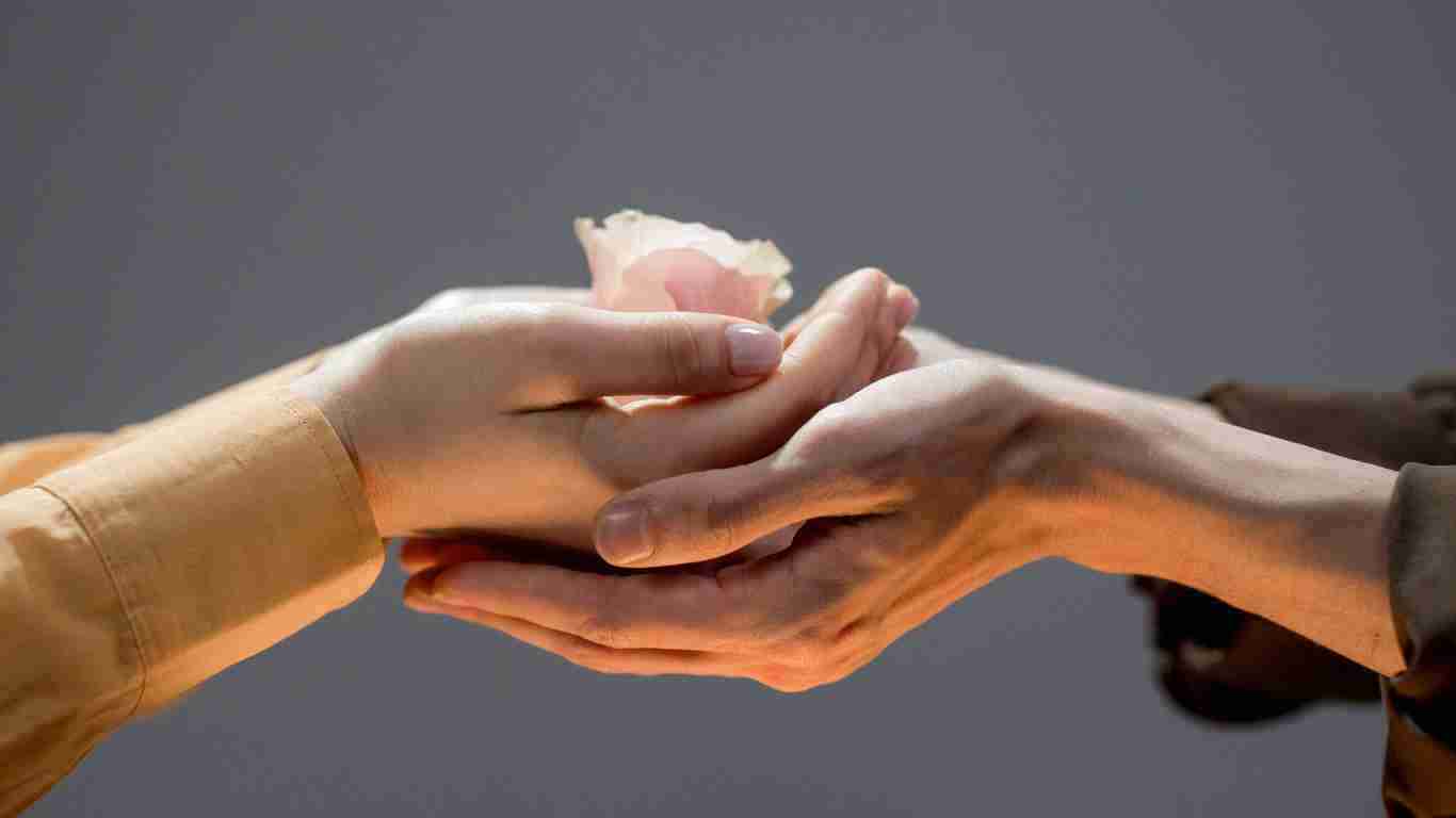 Holding hands to comfort a person in pain