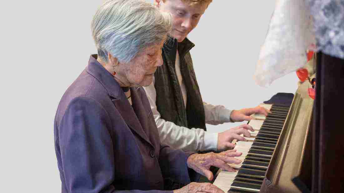 An old lady playing the piano