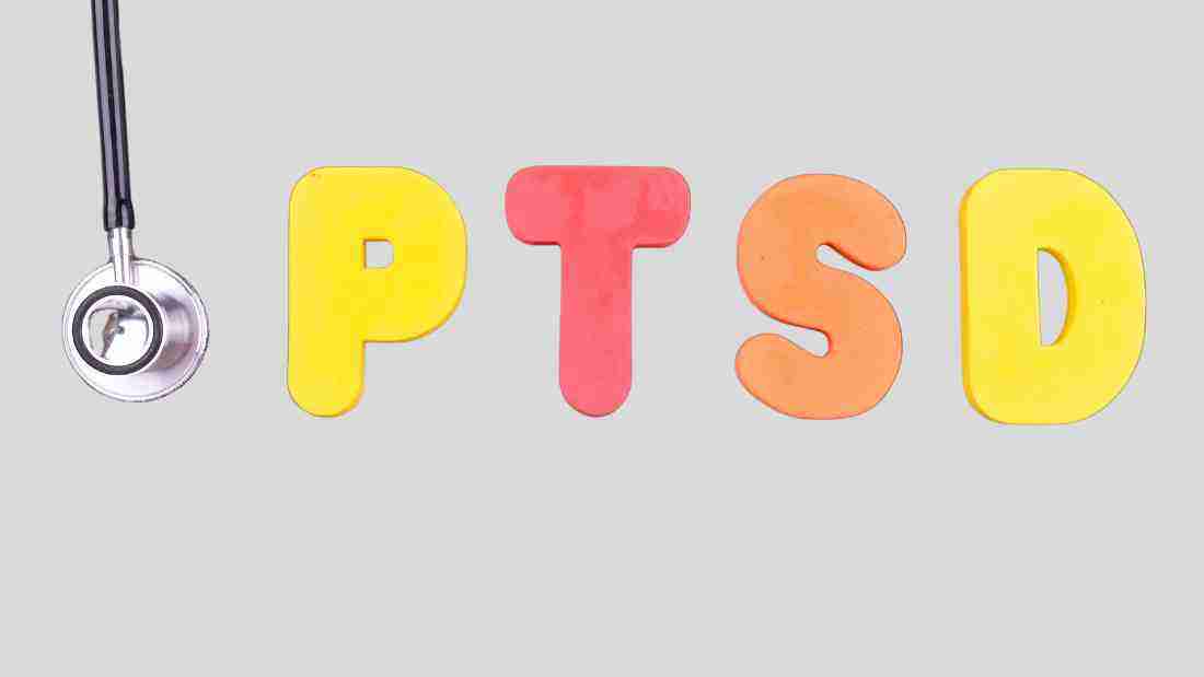 The word PTSD next to a stethoscope, symbolizing the diagnosis of this condition