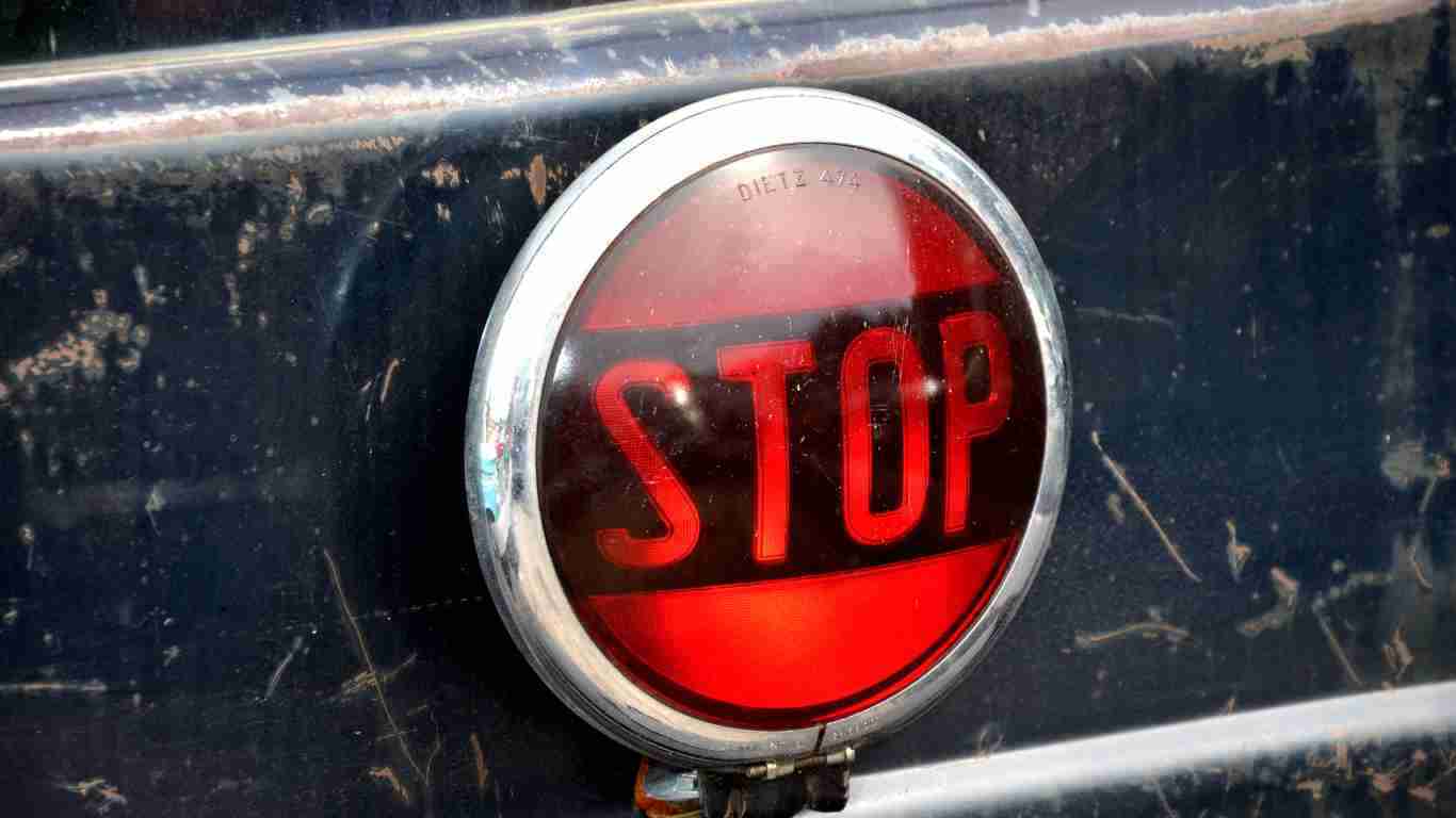 A flashing red light saying STOP