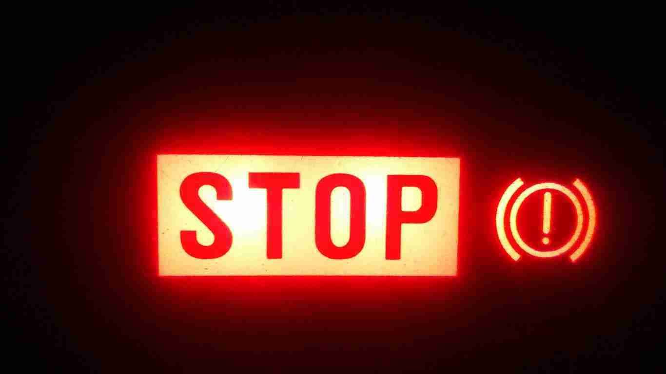 A stop sign lit up in red