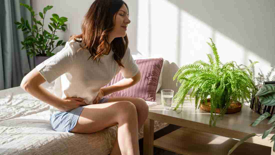 A woman who has a bad stomach ache