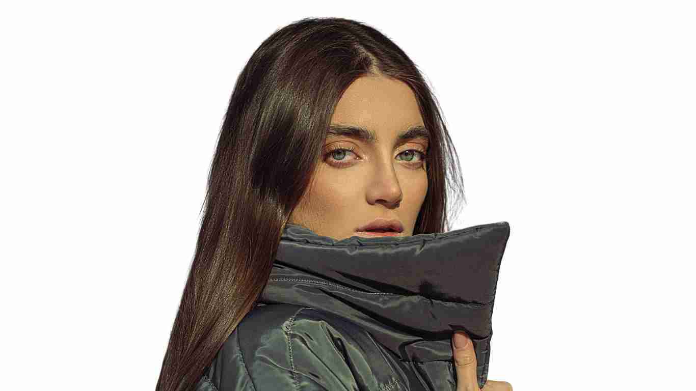 A woman staring at the camera with an arrogant expression on her face