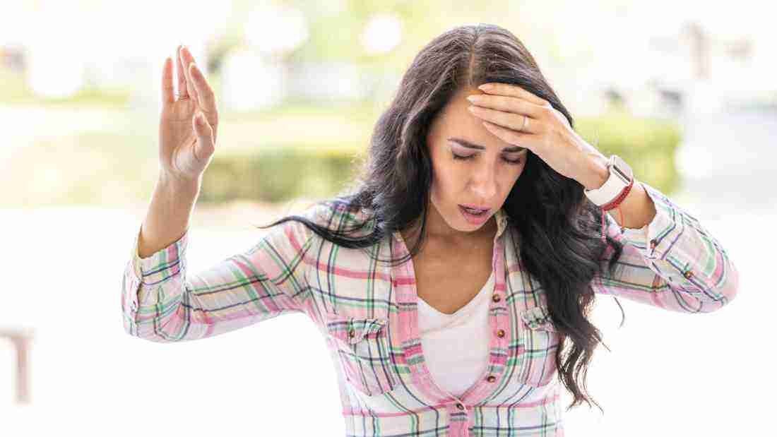 A woman feeling dizzy