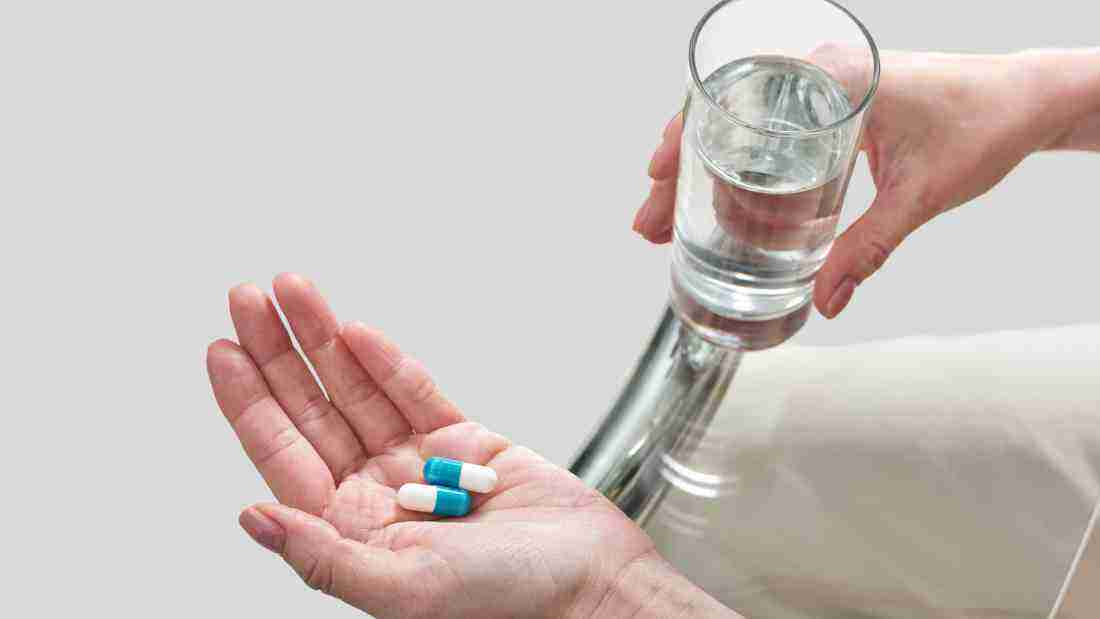 A man taking his medication