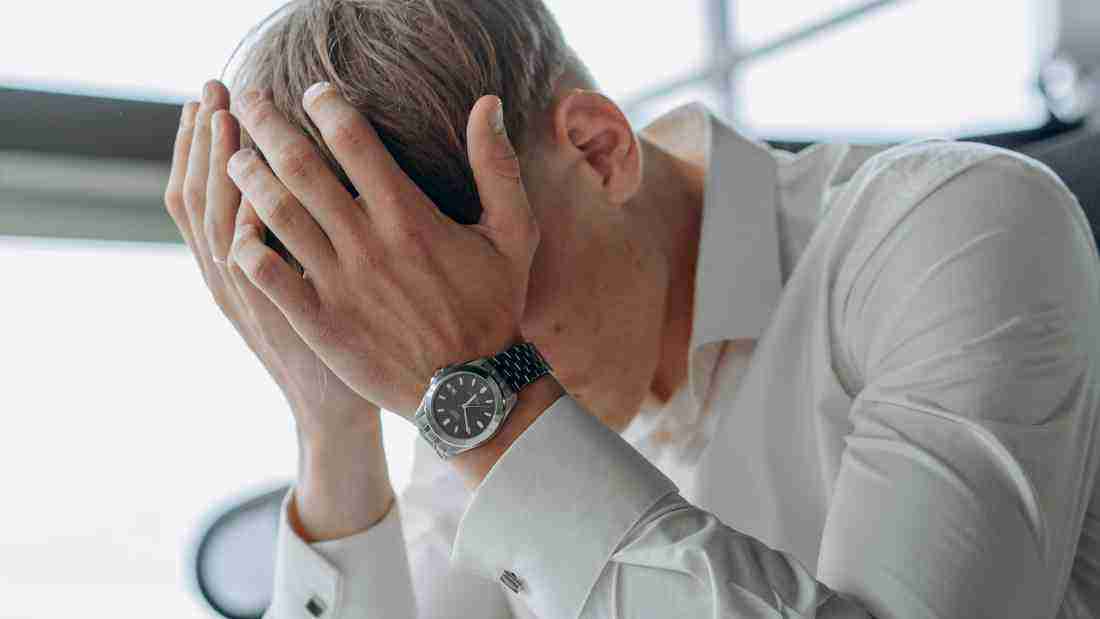 A man holding his head in despair