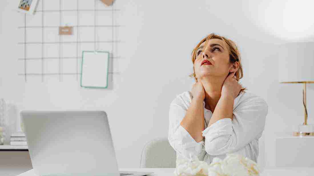 A very stressed woman looking up at the ceiling in despair