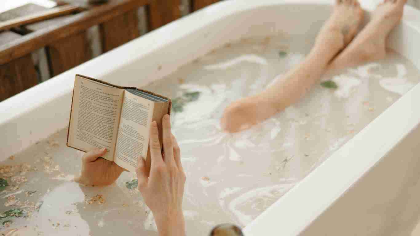 A woman reading in the bath