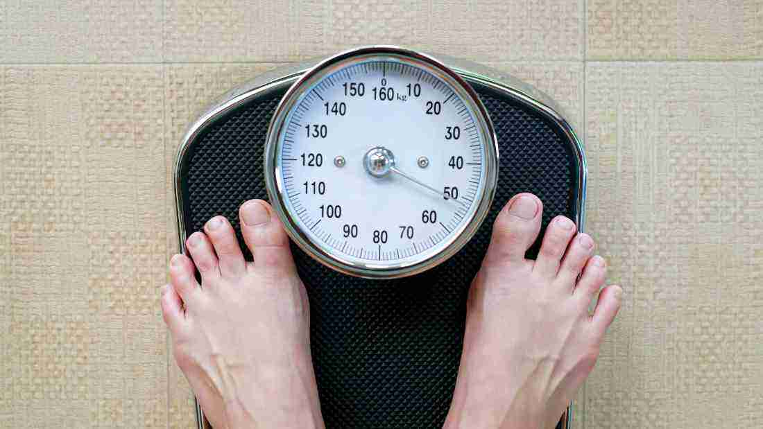 standing on the weighing scales