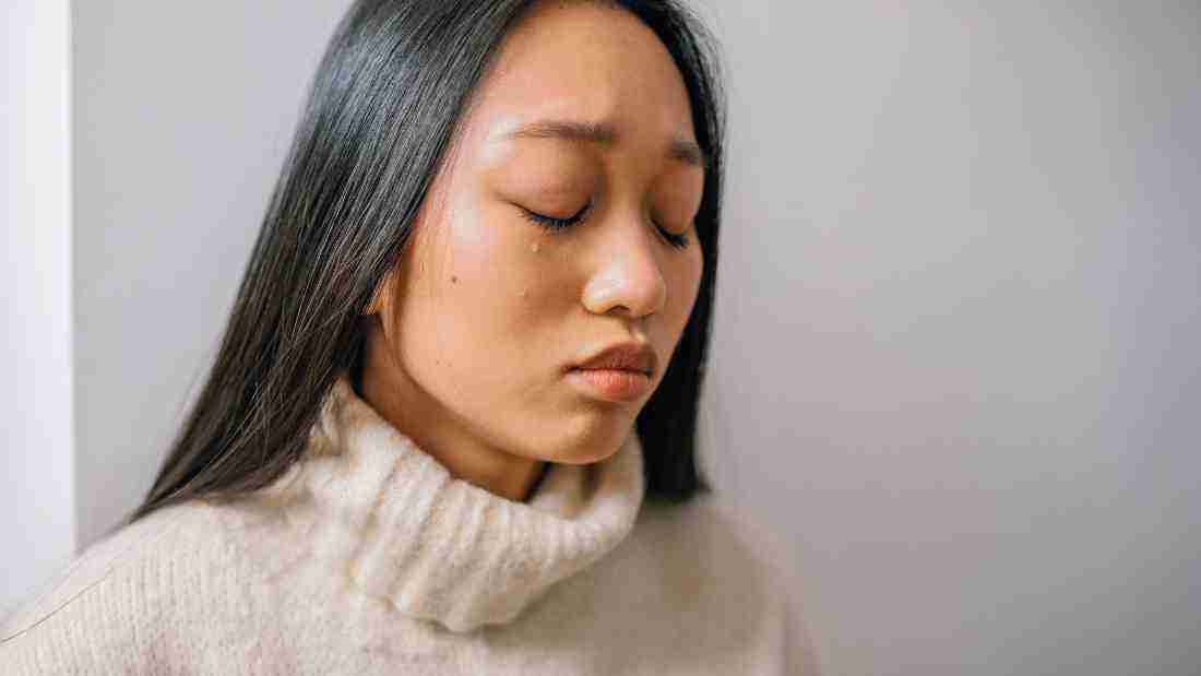 A sad woman who is crying