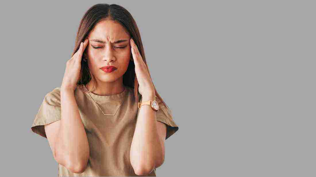 A very confused woman massaging her temples