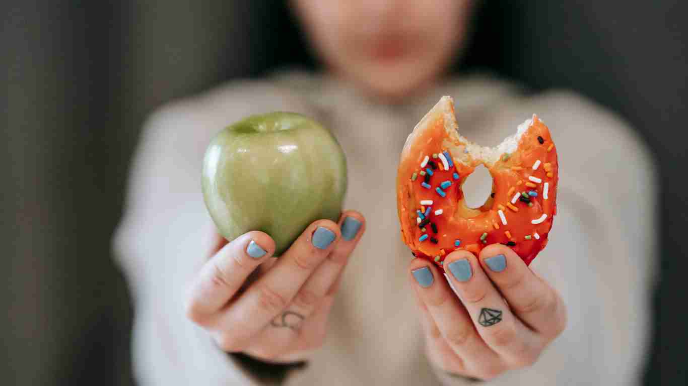 A woman eating a doughnut
