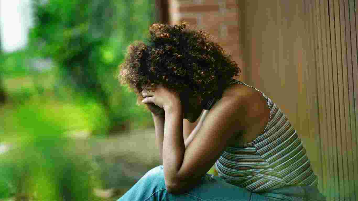 A woman crying as she grieves