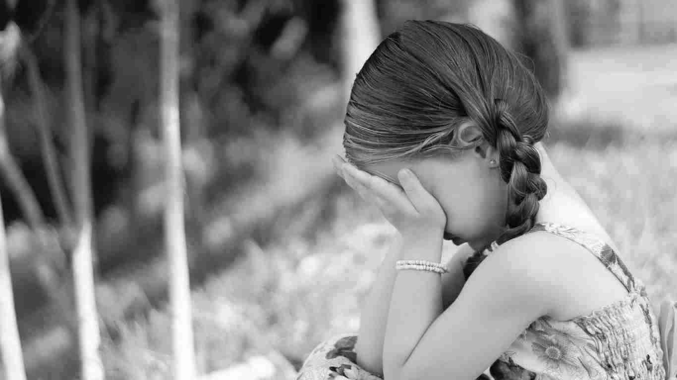 A lonely little girl crying