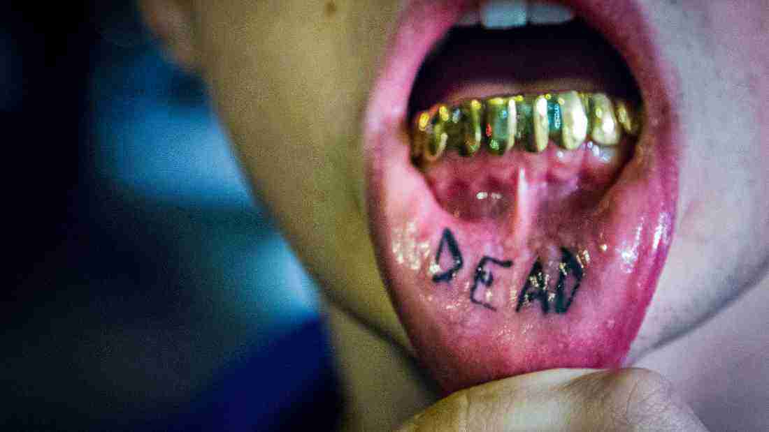 A person with dramatic tattoos on their lips