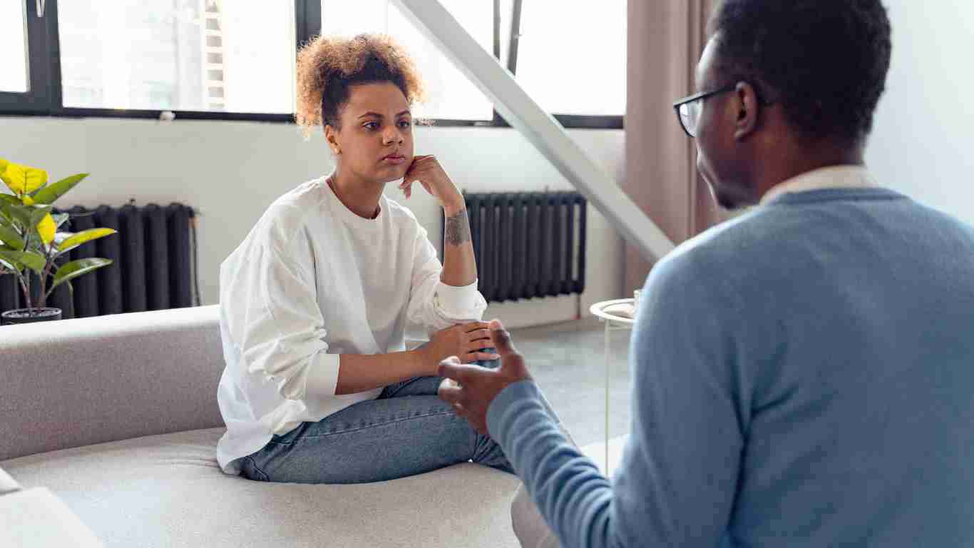 A young woman talking to her therapist