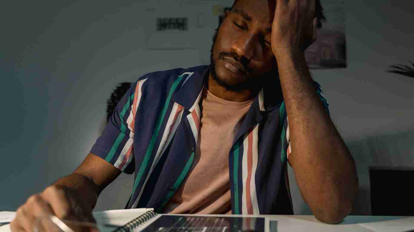 A man who appears to be very tired and totally demotivated