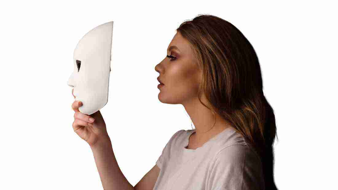 A woman taking off her mask