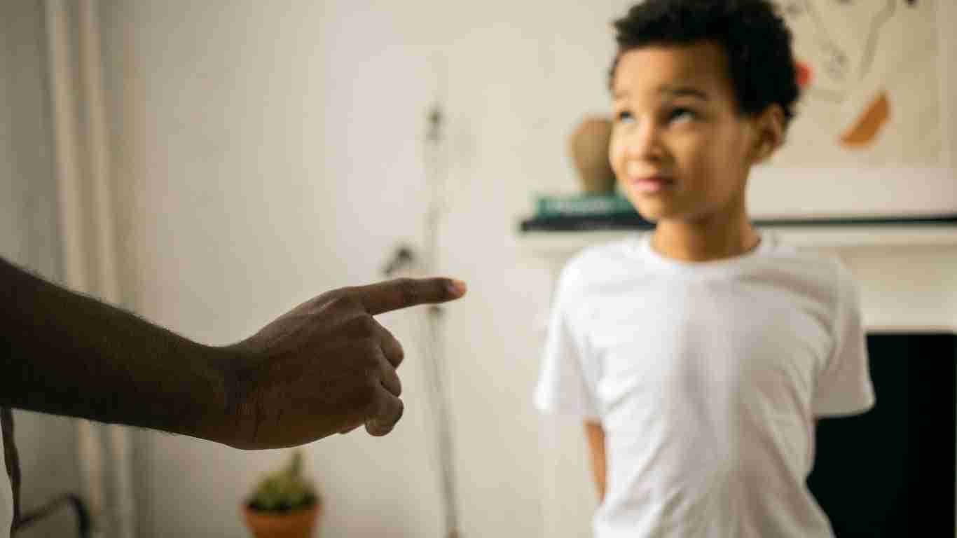 An angry man shouting at a child