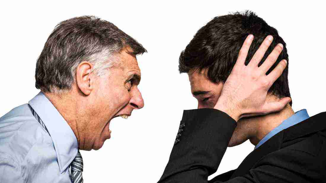 A boss screaming at an employee