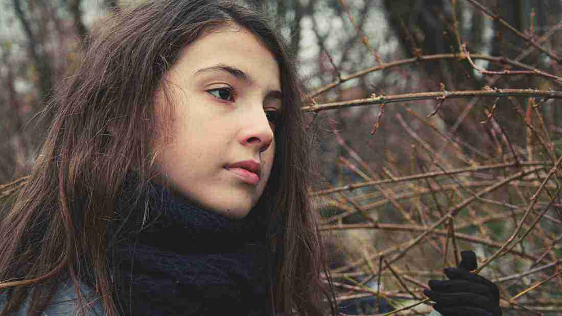 A woman gazing wistfully to the side