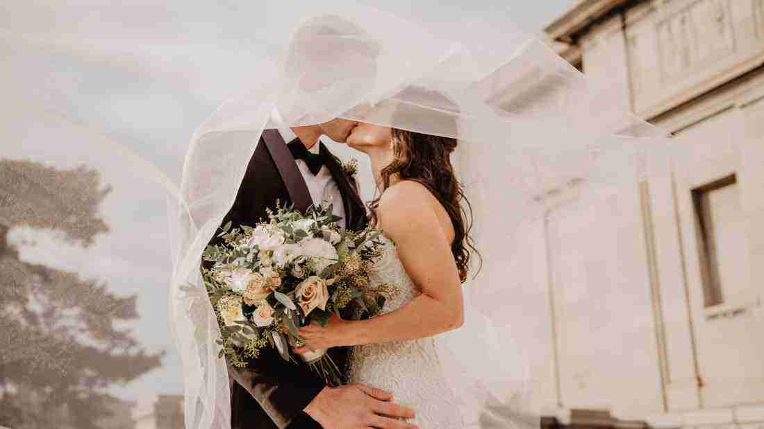 Bride and groom kissing