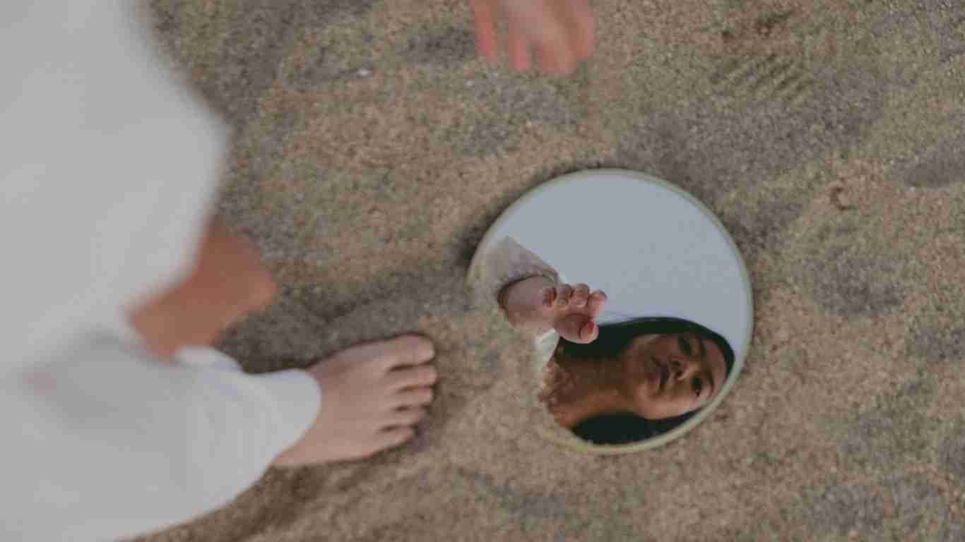 A woman gazing at herself in the mirror