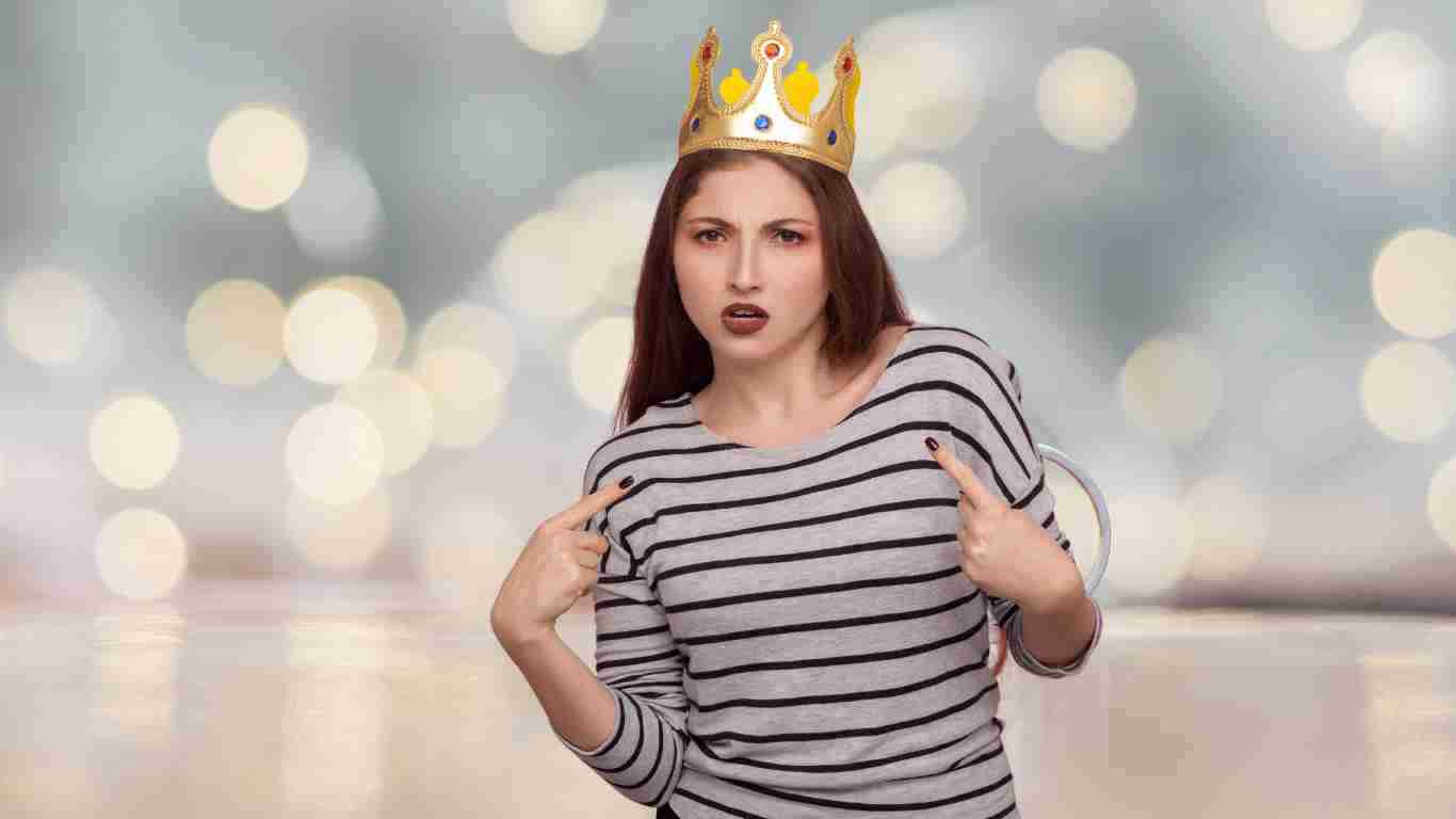 A woman wearing a golden crown, representing her narcissistic traits