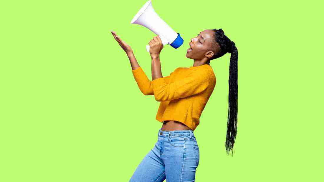 A woman speaking up using a megaphone