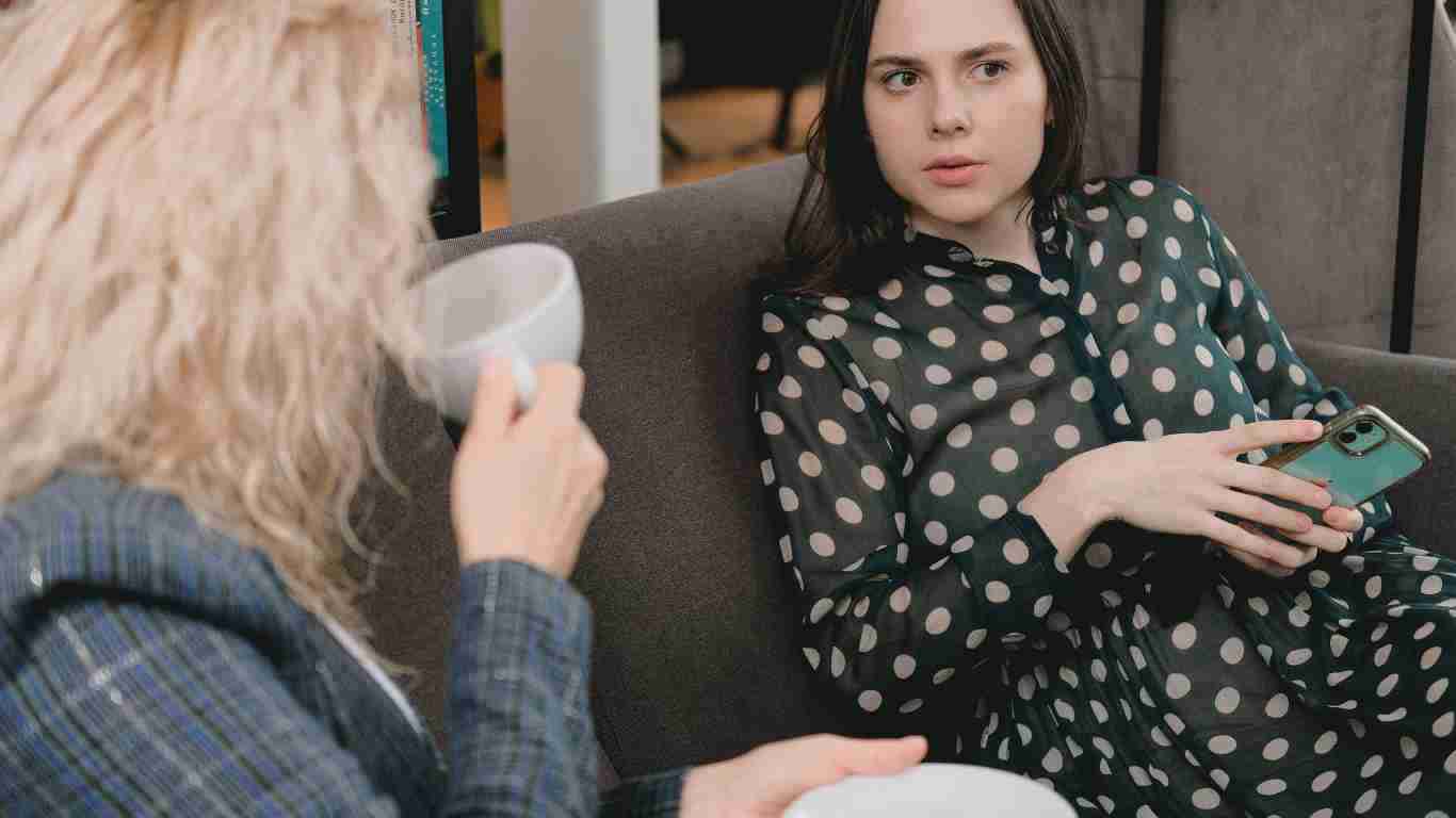 Two women gossiping