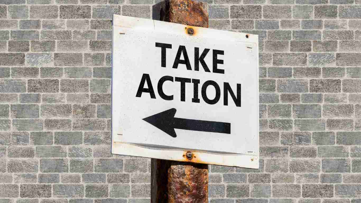 A sign saying TAKE ACTION