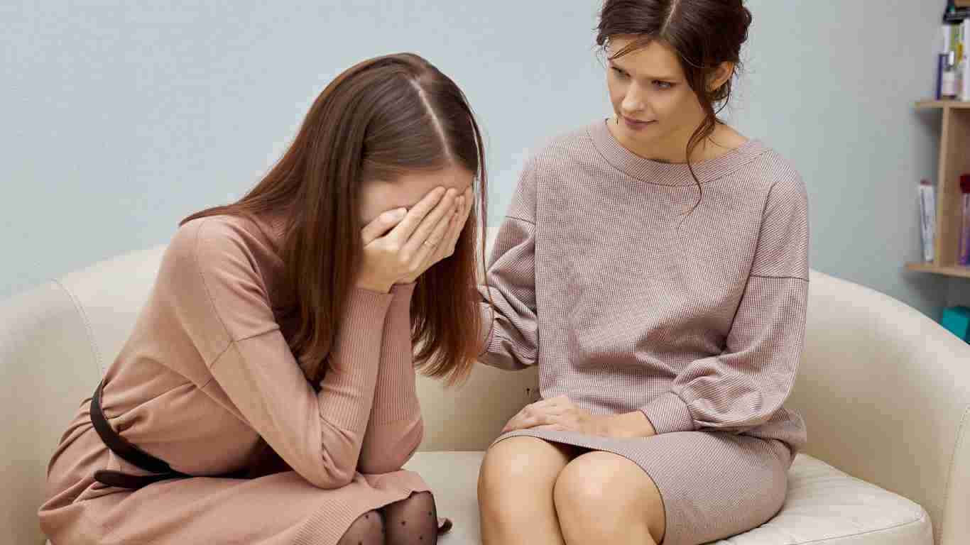 A woman crying during a therapy session
